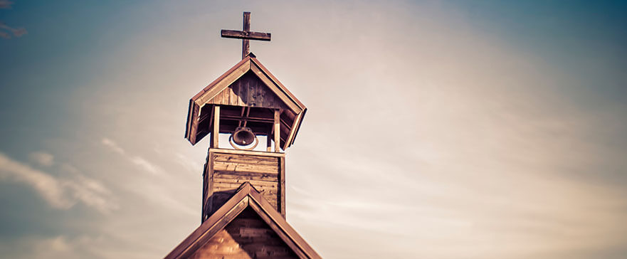 Rural old church steeple cross and bell tower