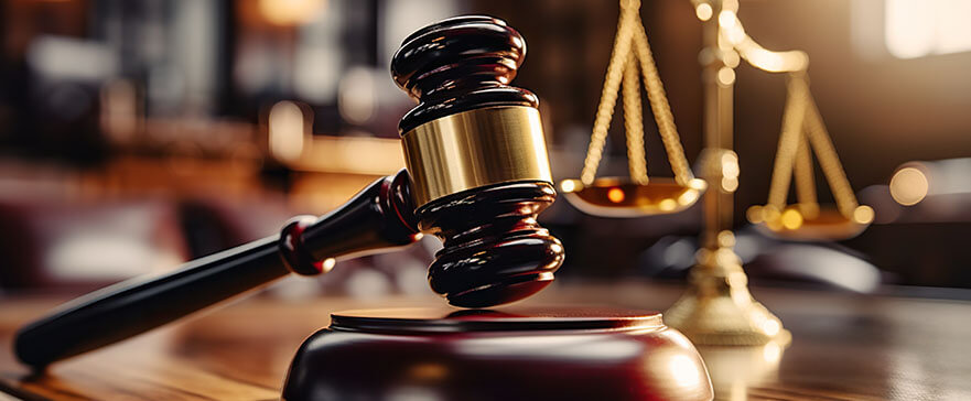 Close-up of gavel on judge desk, symbolizing court trial, justice and legal decisions in courtroom