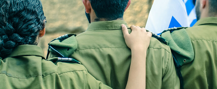 Israeli soldiers with flag of Israel on blurred background of We